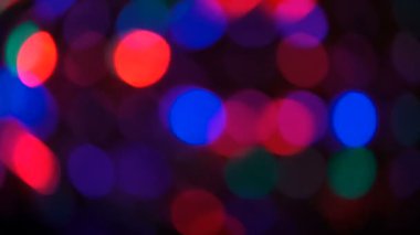 Parçacıklar hareket. Renkli, bulanık, bokeh ışıklar arka plan.