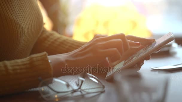 Hand of young girl scrolling photos in her mobile — Stock Video