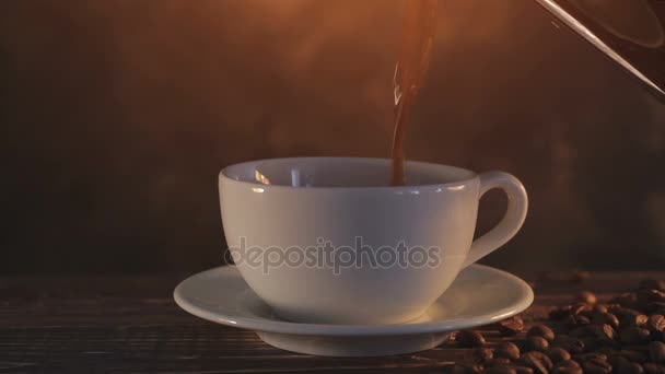 Steaming coffee on dark brown background — Stock Video