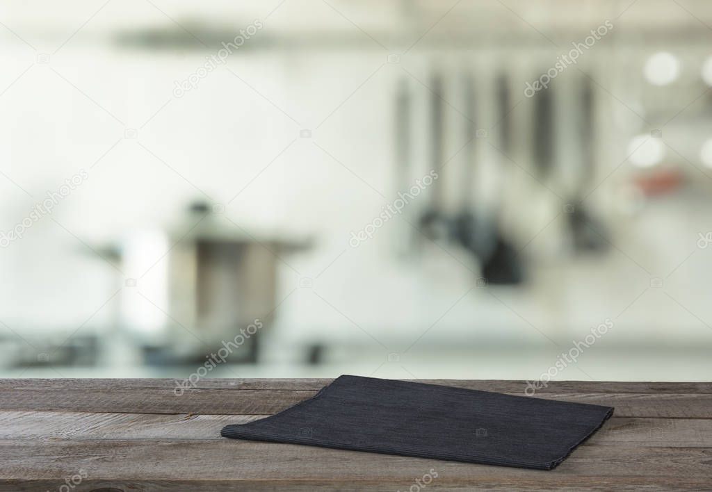 Blurred and abstract background. Empty wooden tabletop and defocused modern kitchen background for display or montage your products.