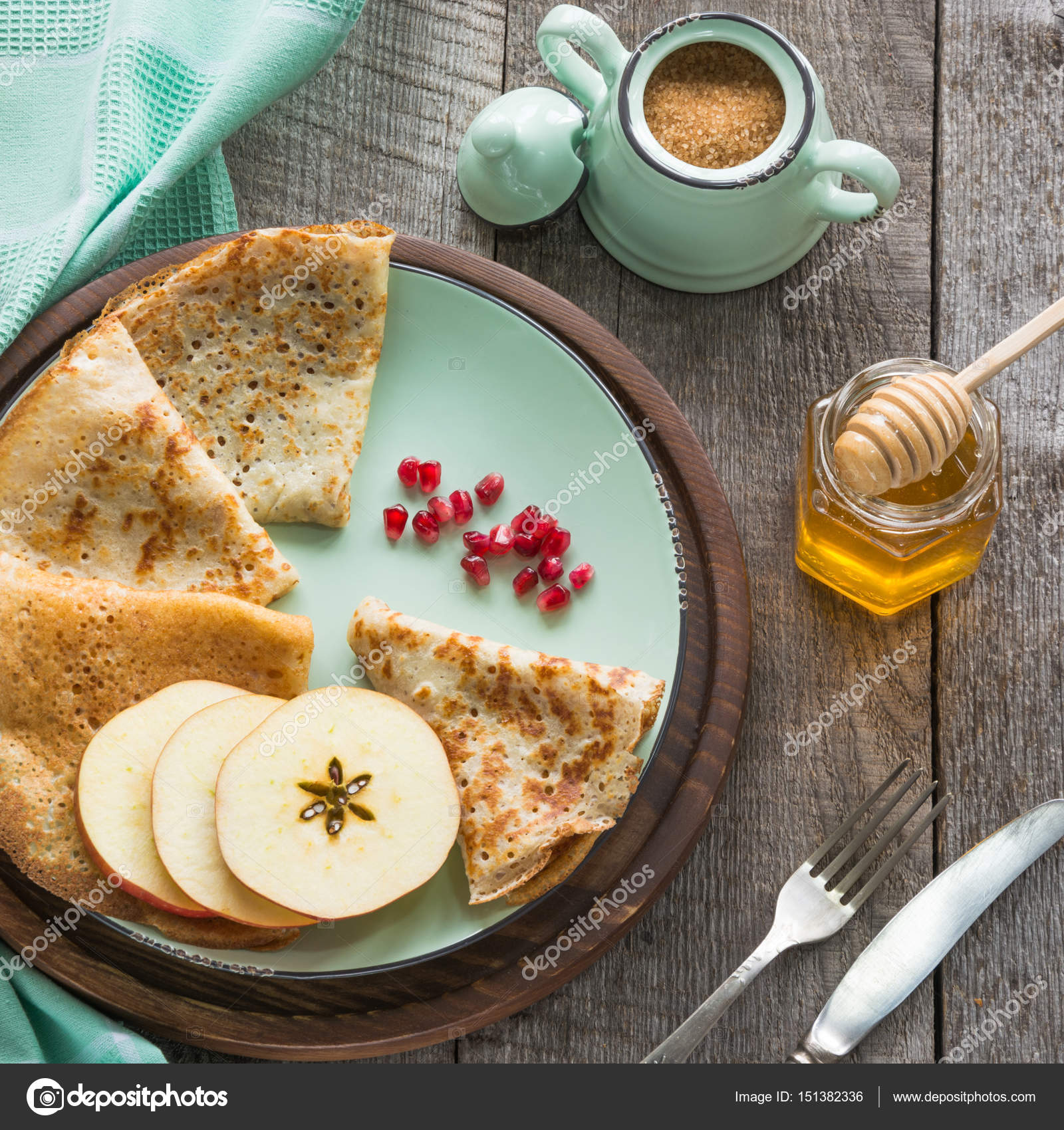 Tasty traditional russian breakfast of pancakes with honey on plate. Rustic  style. Stock Photo by ©Svetlana_Cherruty 151382336