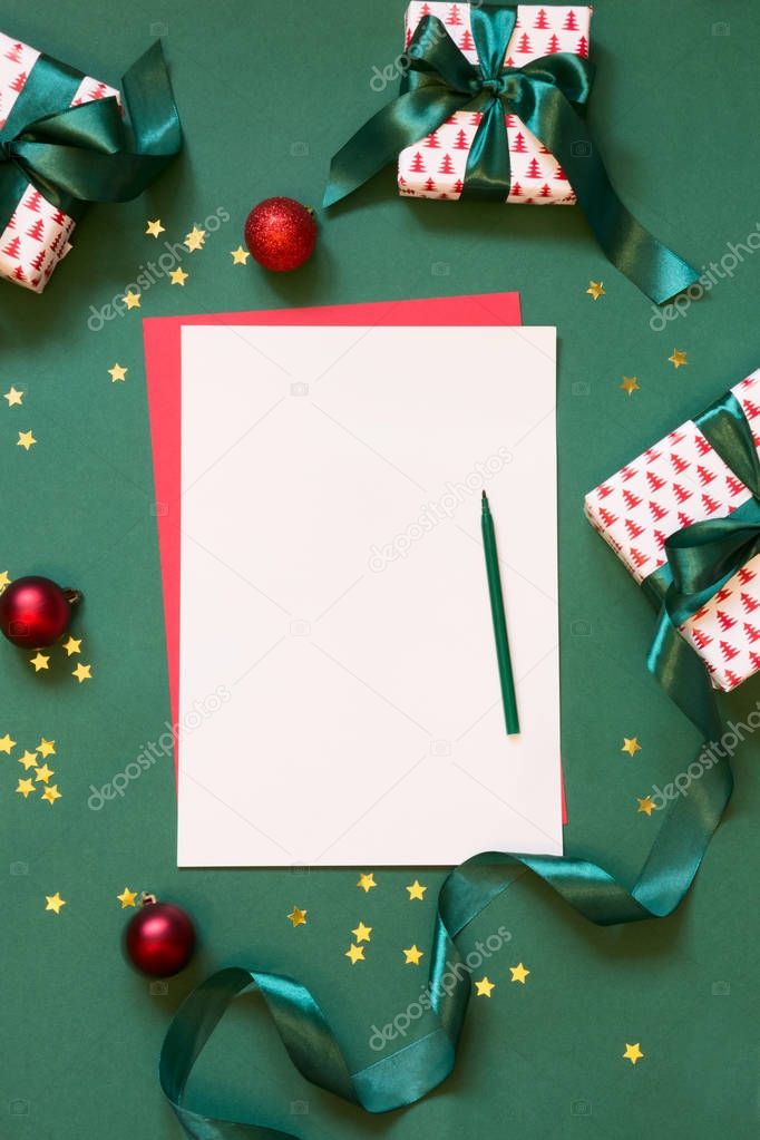 Christmas empty blank for letter to Santa or your wishlist, advent activities on green. Top view.