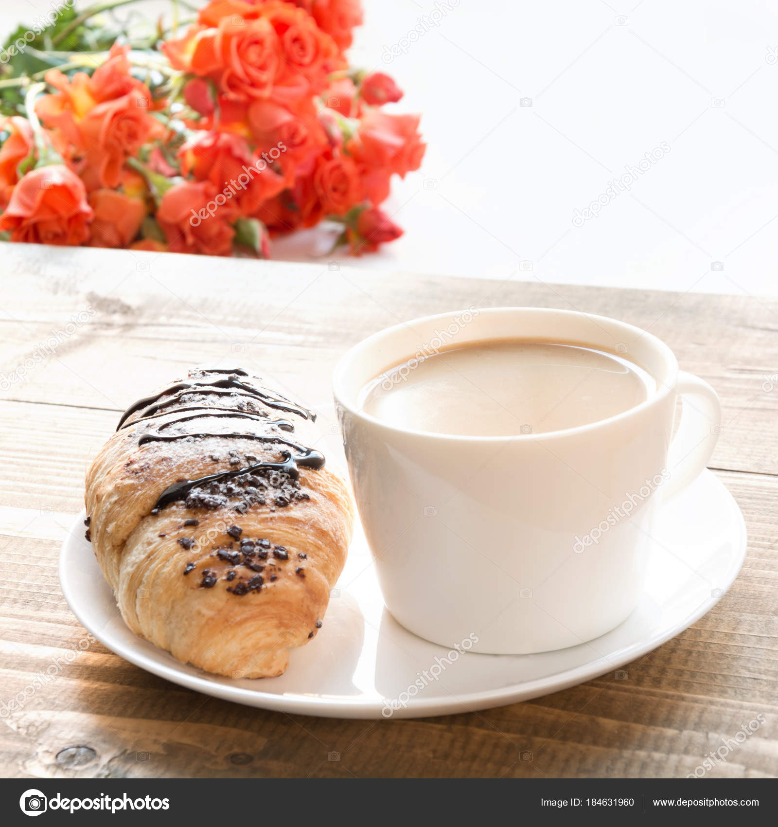 Freshly Baked Chocolate Croissants And Cup Of Coffee On Wooden Table Breakfast Concept Freshly Baked Chocolate Croissants And Cup Of Coffee On Wooden Table Breakfast Concept