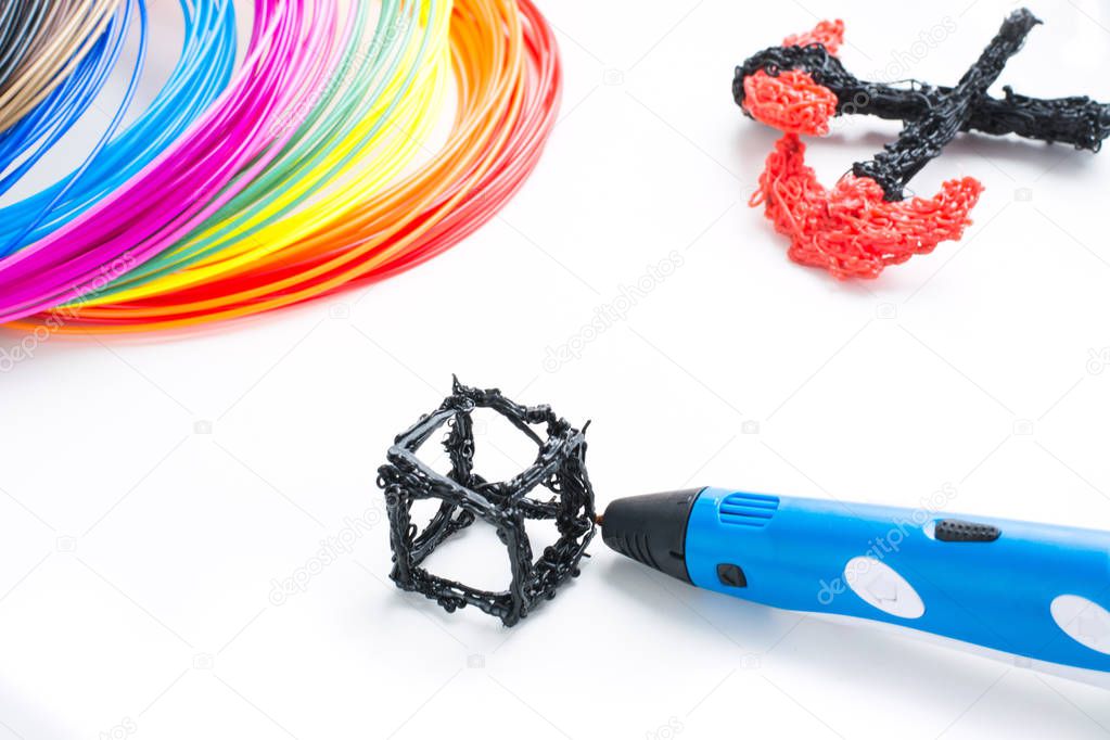 Colorful rainbow plastic filaments with for 3D pen laying on white. New toy for child. 3d paintings and figures with their own hands.