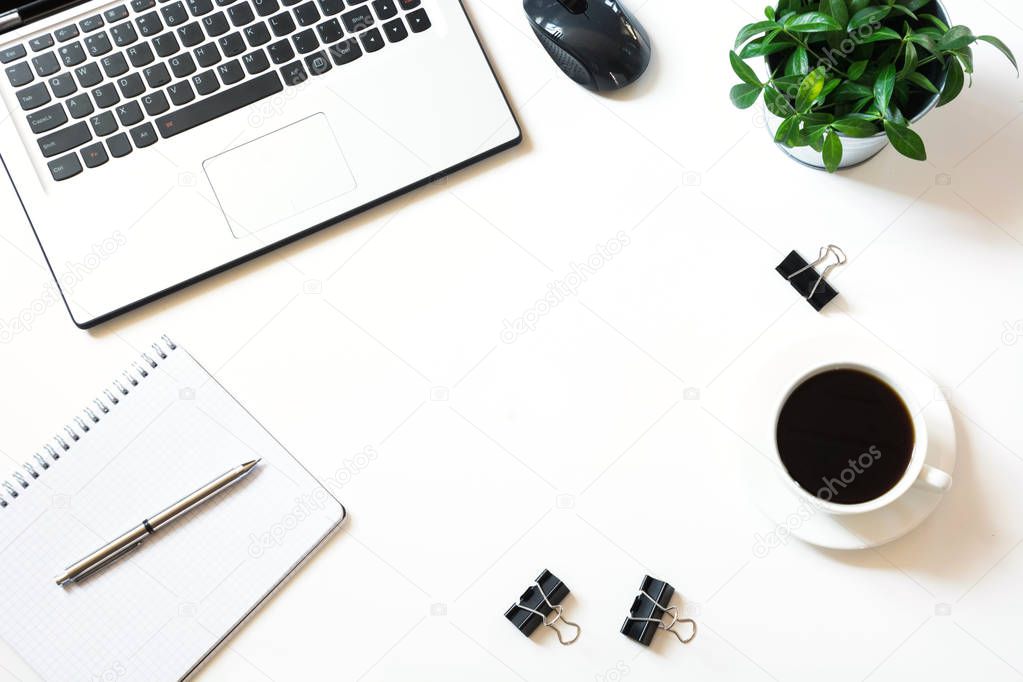 Open laptop on office desk table. Top view, copy space.