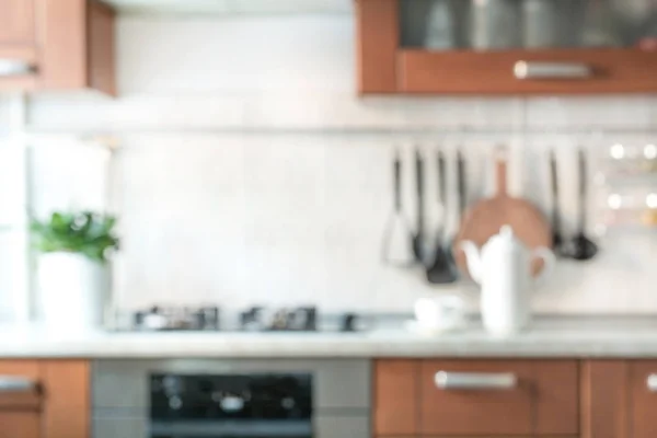 Blurred abstract modern kitchen with bokeh light for background.