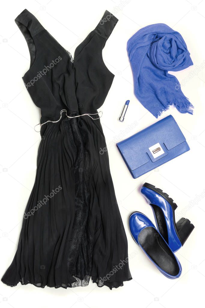 Elegant little women's black dress and blue accessories for celebration or holiday. Flat lay.