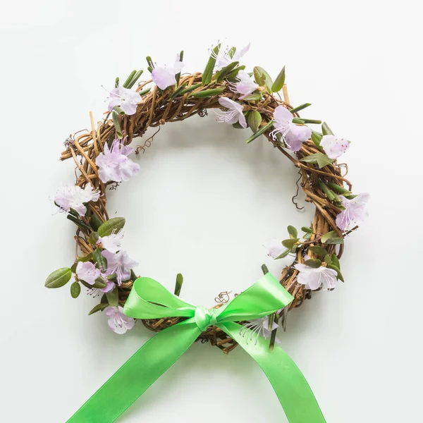 Spring wreath with fresh flowers. Creative flat lay. Top view. Happy easter.