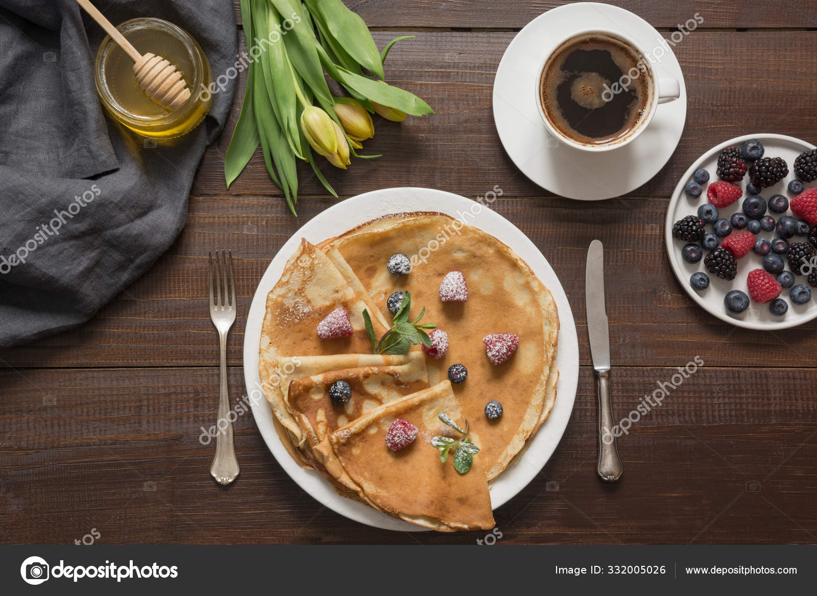 Traditional russian breakfast pancakes, coffee, berry, honey. Springtime.  Shrovetide. Stock Photo by ©Svetlana_Cherruty 332005026