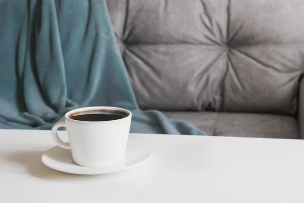 Cup of black coffee in interior for take a break with soft cozy couch. Space for display your products. — 스톡 사진