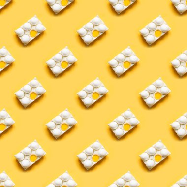 Porselen kutuda sarı üzerine organik beyaz yumurtalar. Soyut model. Kusursuz desen.