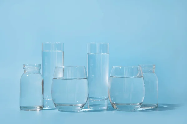 Glasses Clean Water Different Shapes Blue Concept Benefits Clean Fresh — Stock Photo, Image