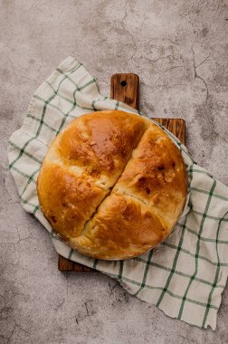Large round homemade wheat bread on the table
