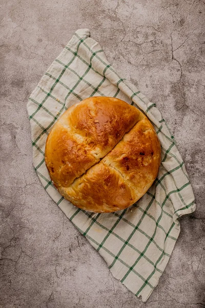 Large round homemade wheat bread on the table — Stock Photo, Image