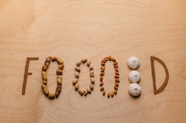 Creative bright writing on the table made from nuts and cinnamon