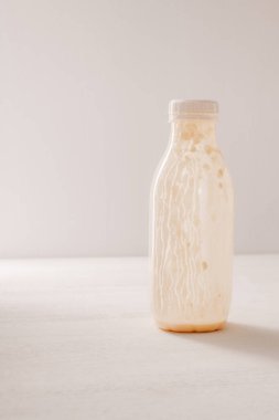 Empty yogurt bottles with a lid for plastic recycling