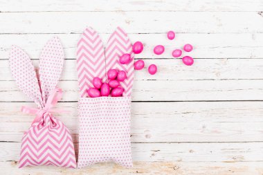 Bunny treat bag with pink candy.  Easter concept clipart