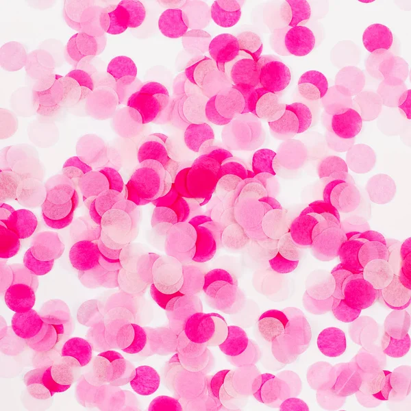 Achtergrond van roze papieren confetti, vakantie/verjaardag concept — Stockfoto