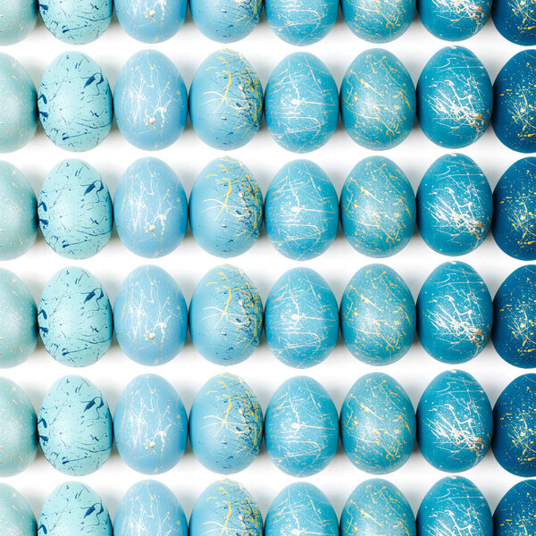 Pattern background  with  blue and turquoise speckled easter eggs.  Ester concept