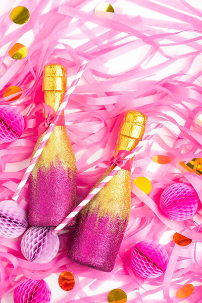 bottles with confetti and honeycomb balls