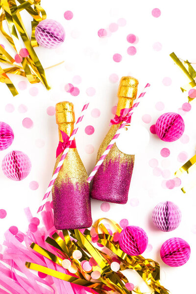 golden and pink champagne bottles