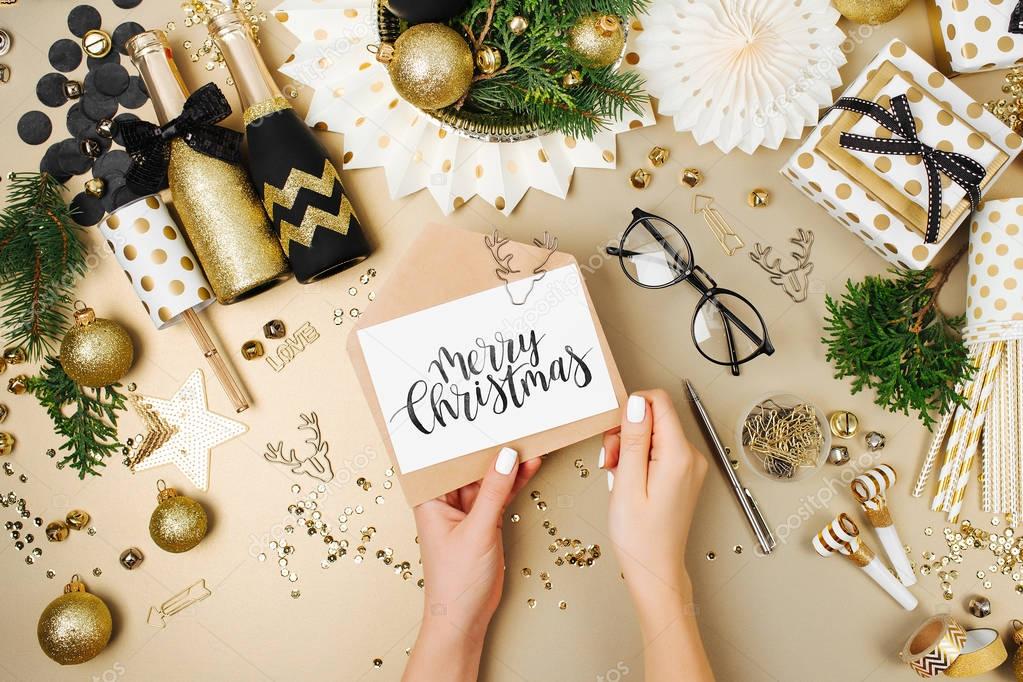 woman holding Merry Christmas card