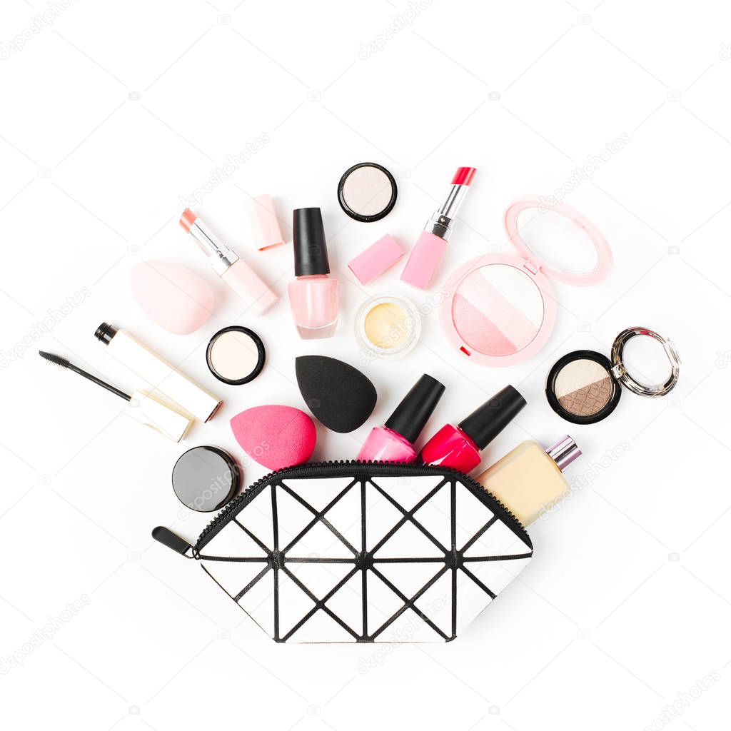 Cosmetic bag with beauty accessories and makeup product. Flat lay