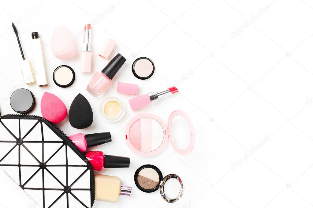 Cosmetic bag with beauty accessory and makeup product. Top view, copy space.