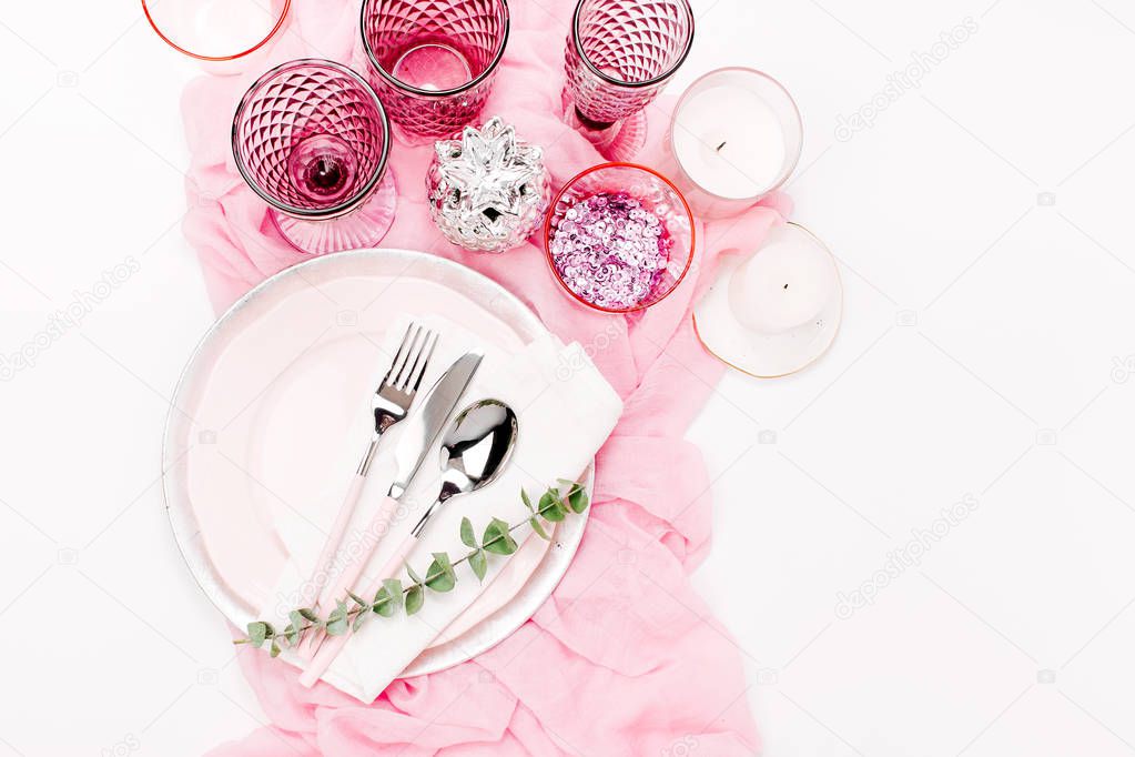 Composition of tableware in pastel pink and white colours isolated on white background