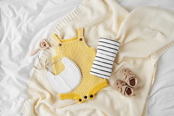 Yellow Bodysuit Bib Baby Boots Toy Knitted Blanket Set Kids — Stockfoto