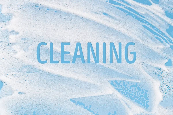 White Soapy Foam Blue Background Cleaning Washing Concept — ストック写真
