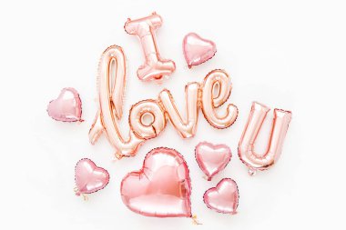 Pale pink Foil Balloons in the shape of the word 