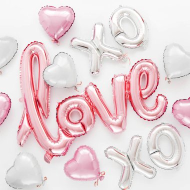 Pale pink Foil Balloons in the shape of the word 