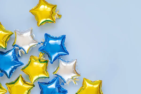 Gold Silver Foil Balloons Star Shaped Blue Background Holiday Celebration — 스톡 사진