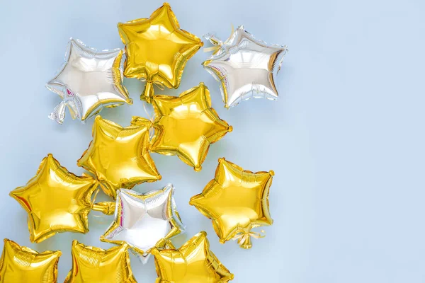 Gold Silver Foil Balloons Star Shaped Blue Background Holiday Celebration — Stockfoto