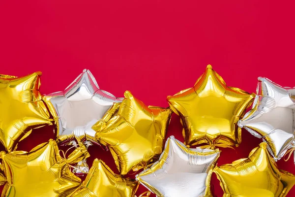Gold Silver Foil Balloons Star Shaped Red Background Holiday Celebration — 스톡 사진