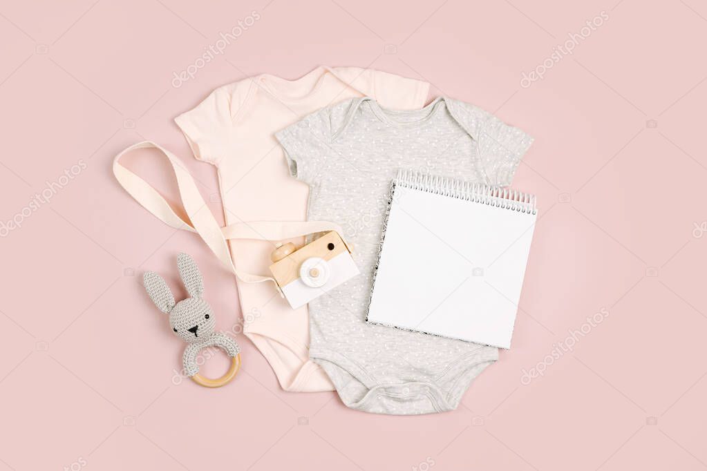 Cute baby bodysuits with mock up card. Set of kids clothes and accessories. Fashion newborn. Flat lay, top view