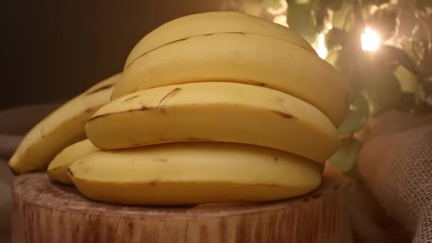 Two Bunches Bananas Top Wooden Board — Stock Video