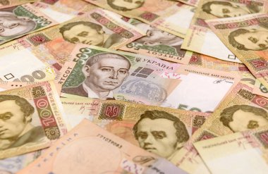 dinero ucraniano y huchaUkraynalı para arka plan