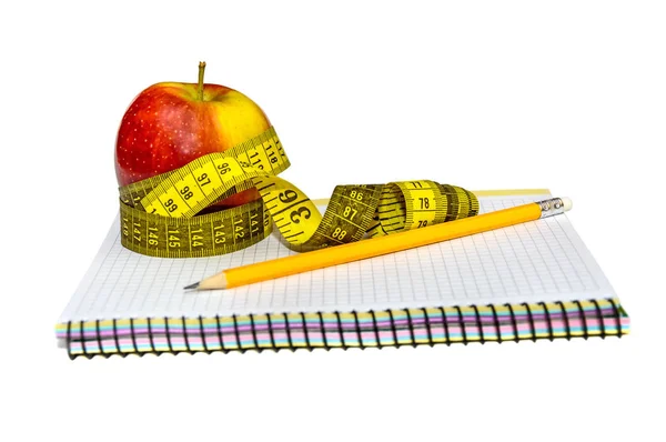 Pusty Notatnik, Czerwone jabłko, ołówek, miara zwijana na tle Obraz Stockowy