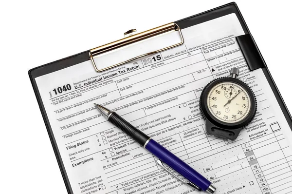 Tax form 1040, pen and stopwatch on clipboard isolated on white — Stock Photo, Image