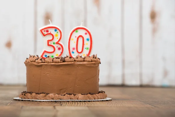 Thirtieth chocolate frosted birthday cake — Stock Photo, Image