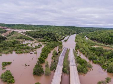 JEROME, MO/USA May 1, 2017:  Flood waters submerge Interstate 44 clipart