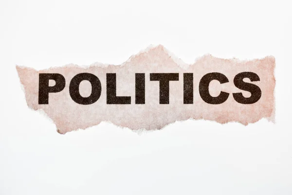 The word politics on old torn paper — Stock Photo, Image