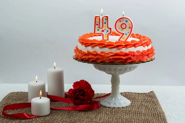 Frosted cake with 49 candle — Stock Photo, Image