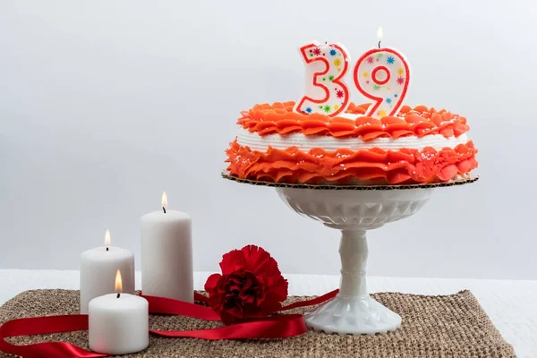 Frosted cake with 39 candl — Stock Photo, Image