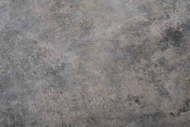 Zor bir gri kaya doku, lekeleri ve karıncalanmış işaretleri ile beton zemin