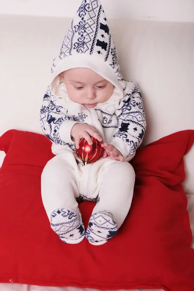 Little baby boy in warm cozy winter clothes, holding Christmas — Stock Photo, Image