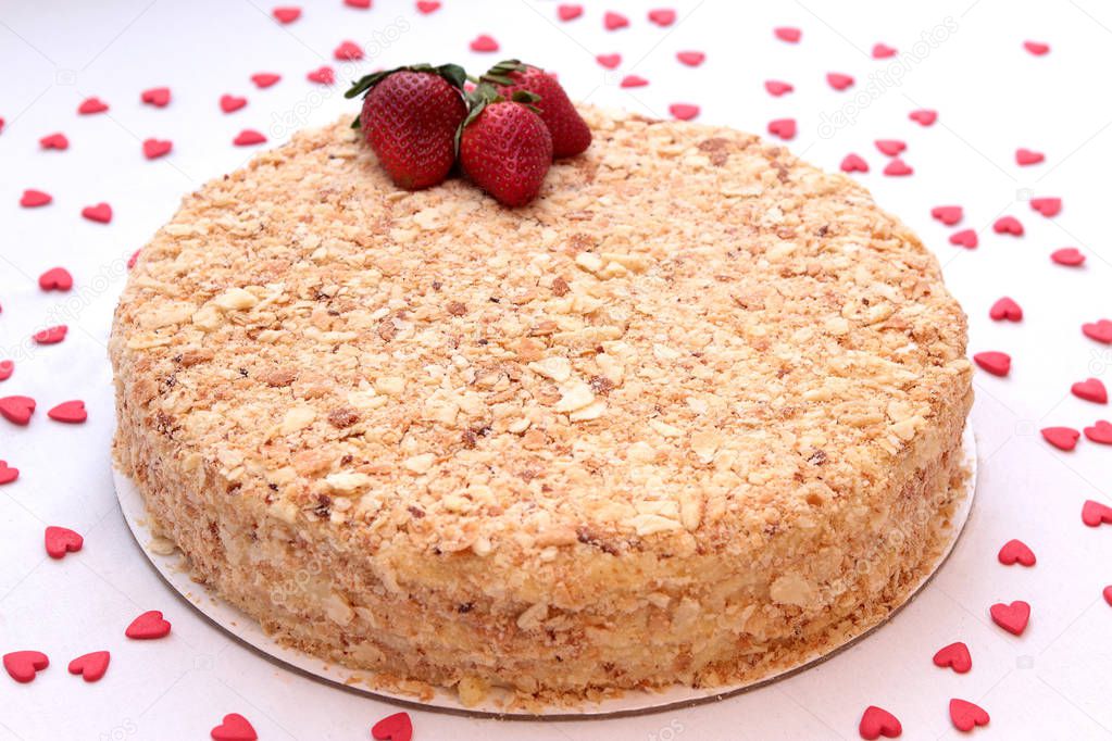 Cake Napoleon with strawberries isolated on a white background