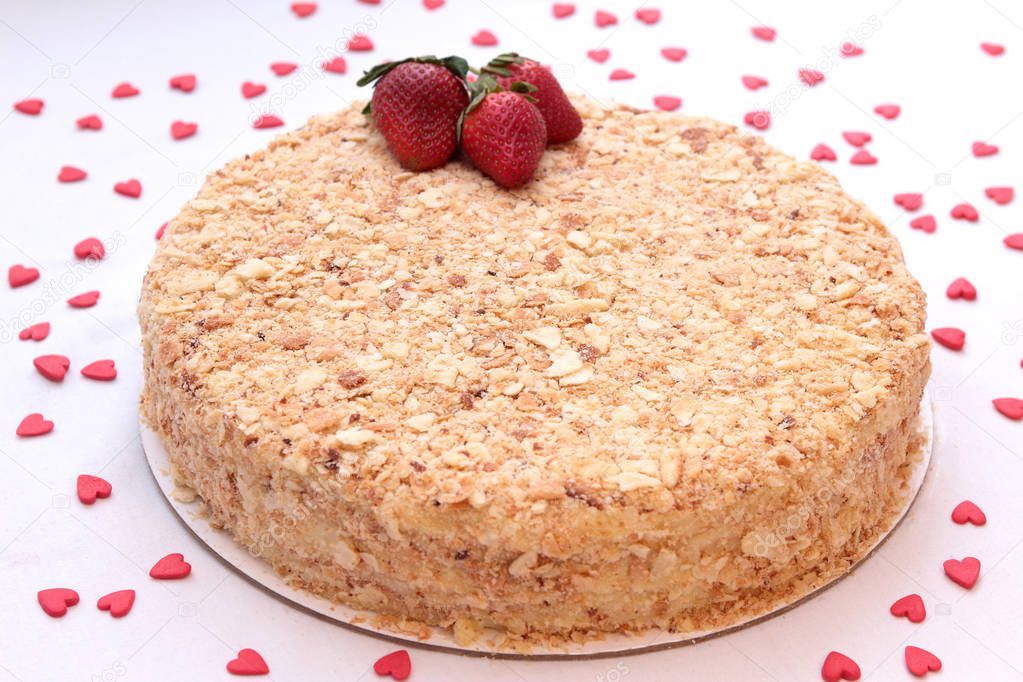 Cake Napoleon with strawberries isolated on a white background